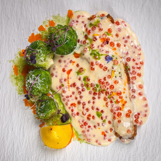 Seabass with caviar sauce.
